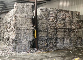 Recyclables wait to be processed in a warehouse.