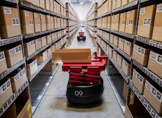 invia robotics modern supply chain operations robots in aisle
