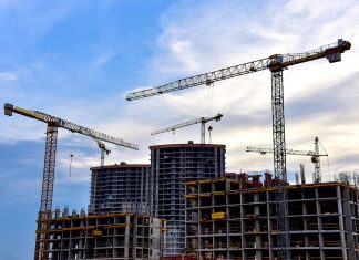 From erecting new buildings to rebuilding bridges, infrastructure work is critical to the future. Photo via Hanbyul Jeong of Unsplash.