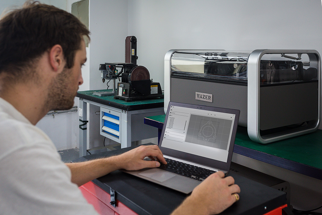 Small-format waterjet cutting machine operating in a shop