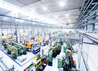 High-angle view inside a manufacturing factory with industrial machinery.