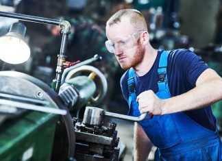 manufacturing employee working with equipment