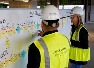 construction planners in front of whiteboard