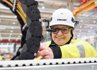 cimcorp employee using assisted reality glasses technology