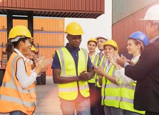 manufacturing employee clapping outside