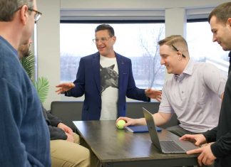Howard Makler, the CEO of Innovation Refunds speaks with employees at the office in West Des Moines, Iowa.Photo Credit: Innovation Refunds